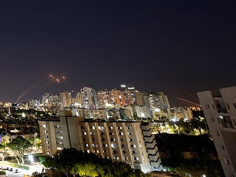 Streaks of light are seen in this file 2021 picture as Israel's Iron Dome anti-missile system intercepts rockets launched from the Gaza Strip.