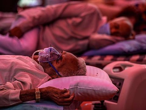 A COVID-19 patient receives free oxygen provided by a gurdwara, a Sikh place of worship, in Delhi, India, on May 11, 2021.