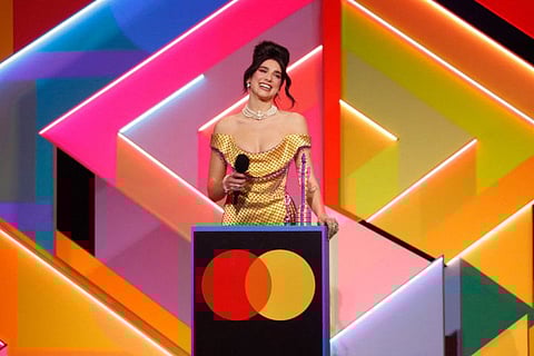 In a handout picture released by the Brit Awards English singer-songwriter Dua Lipa accepts her award for Female Solo Artist at the BRIT Awards 2021 in London on May 11, 2021.