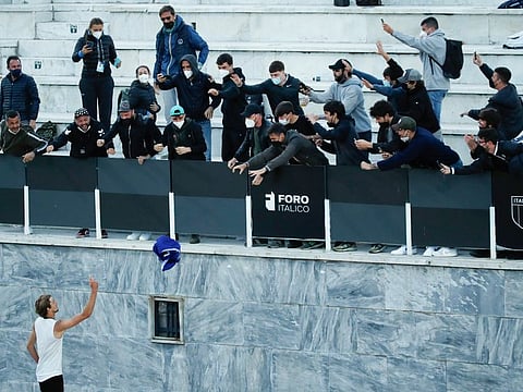Alexander Zverev of Germany celebrates throwing his towel to supporters after beating Kei Nishikori of Japan in their third round match at the Italian Open tennis tournament in Rome on Thursday.