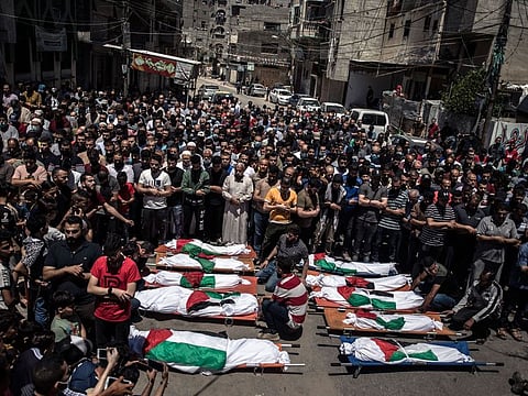 Palestinians perform funeral prayers for 8 children and 2 women of the Abu Hatab family killed by Israel on Saturday, May 15.