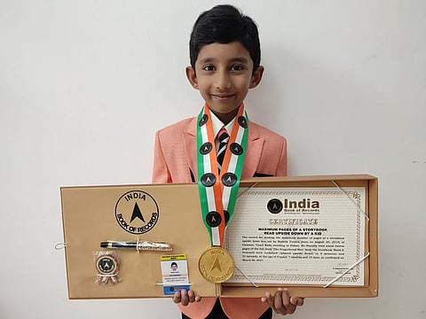 Ranesh Vrishin, studying in KG2 at Delhi Private School (DPS) Dubai, has set a record for reading a book upside down.