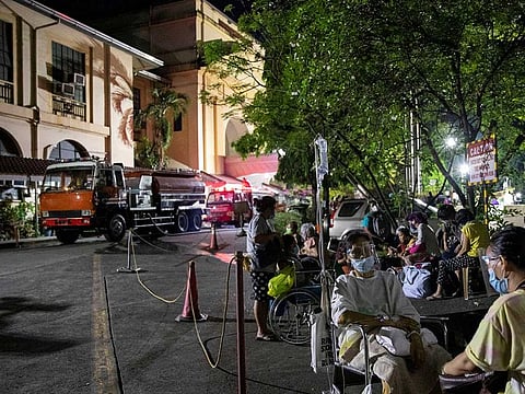 Patients of Philippine General Hospital are evacuated after a fire broke past midnight.