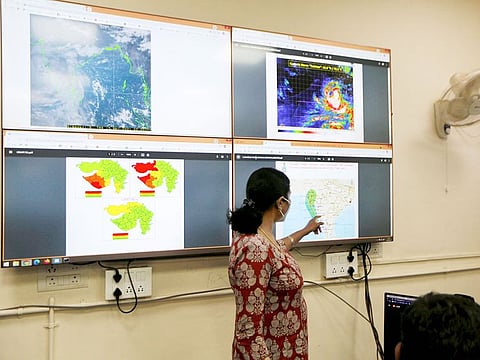 An Indian Meteorological Department scientist monitors cyclone Tauktae inside her office in Ahmedabad, on Saturday, May 15, 2021.