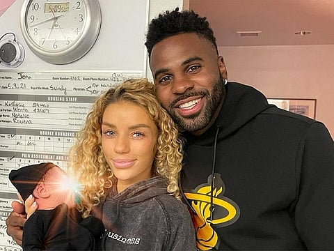 Jason Derulo and girlfriend Jena Frumes with their son.