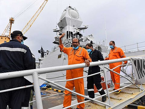 Rescued crew members from the sunken offshore barge P305 disembark from the INS Kochi naval ship after arriving in Mumbai on May 19, 2021 following Cyclone Tauktae's landfall on India's west coast.