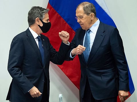 U.S. Secretary of State Antony Blinken, left, greets Russian Foreign Minister Sergey Lavrov, right, as they arrive for a meeting at the Harpa Concert Hall in Reykjavik, Iceland, Wednesday, May 19, 2021, on the sidelines of the Arctic Council Ministerial summit.