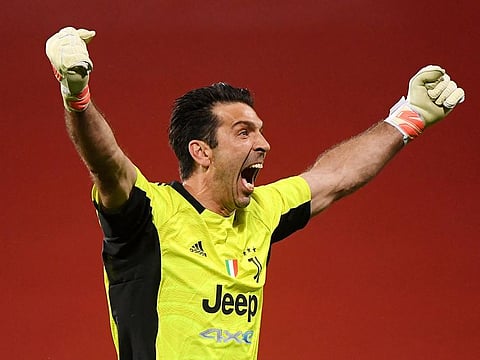Juventus' Gianluigi Buffon celebrates after Federico Chiesa scored their second goal.
