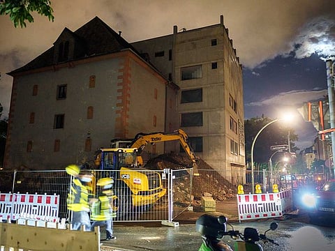 A fire truck stands by a bunker in the middle of the Nordend district, where a 500-kg bomb from World War II had previously been detonated in a controlled manner, in Frankfurt, Germany, early Thursday, May 20, 2021. According to initial findings, there was no discernible damage in the surrounding area, the fire department said.