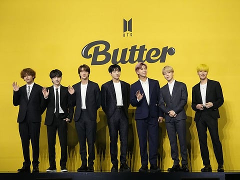 Members of South Korean K-Pop band BTS pose for photographers ahead of a press conference to introduce their new single "Butter" in Seoul, South Korea, Friday, May 21, 2021.