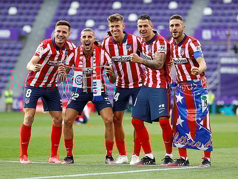 Atletico players celebrate the title