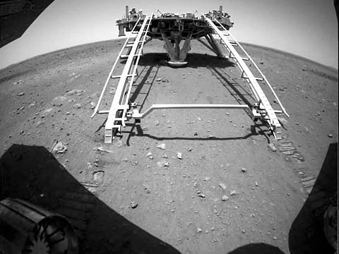 Chinese rover Zhurong of the Tianwen-1 mission drives down the ramp of the lander onto the surface of Mars, in this screenshot taken from a video released by China National Space Administration (CNSA) May 22, 2021.