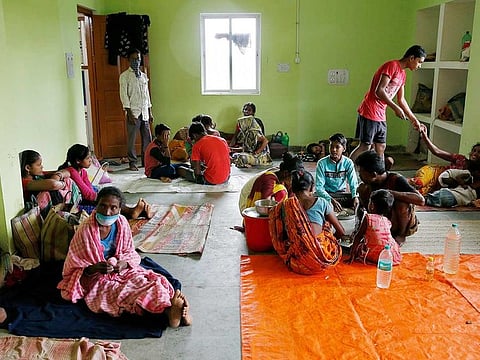 People rest inside a shelter after they were evacuated from their houses in coastal areas ahead of Cyclone Yaas at Digha in Purba Medinipur district in the eastern state of West Bengal, India, May 25, 2021.