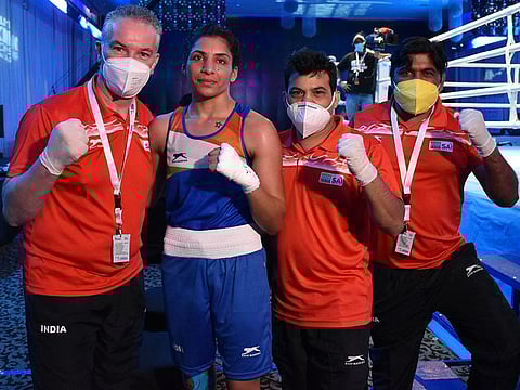Simran, a member of the Tokyo-bound Indian contingent, poses with coaches in Dubai after her win on Tuesday.