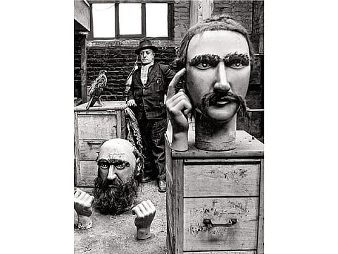 The giant heads of the North photographed by Robert Doisneau, around 1908