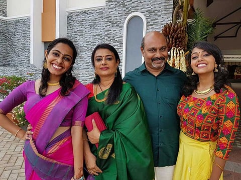 Gulf News assistant editor Santhosh Kumar with his wife Maya, and daughters Shruti and Pallavi.