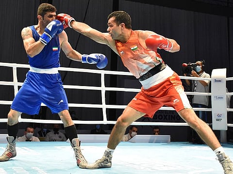 India's Vikas Krishan (right) scored a creditable win against Iran’s Moslem Malamir 4-1 in the 69kg quarter finals on Wednesday.