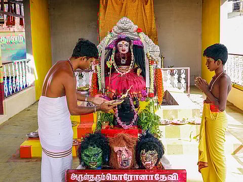 Devotees pray at a newly built temple dedicated to ‘Corona Devi' in the wake of second wave of coronavirus, at Irugar in Coimbatore, Friday, May 21, 2021.