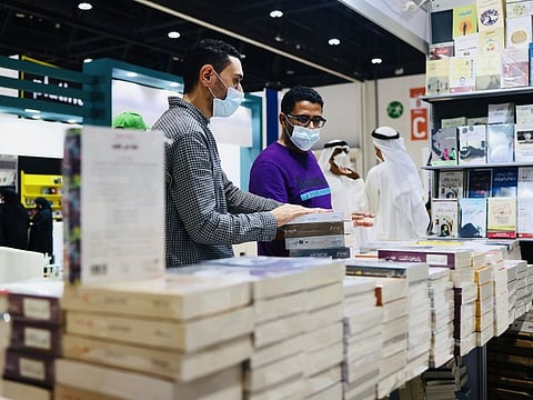 People enjoy browsing through local and international book collections at the Abu Dhabi International Book Fair in Adnec, Abu Dhabi.