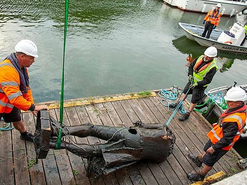 In this file photo taken on June 11, 2020 shows the statue of Edward Colston being retrieved from the harbour in Bristol, southwest England.