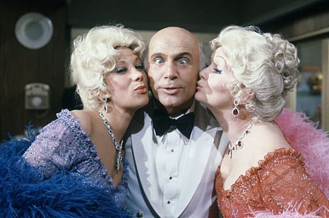 In this Oct. 15, 1982 file photo shows Gavin MacLeod with actress Debbie Reynolds and Marilyn Michaels on the set of "The Love Boat." Gavin MacLeod has died. His nephew told the trade paper Variety that MacLeod died early Saturday, May 29, 2021.