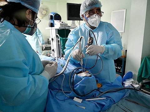 Dr B.P. Tyagi, along with his team of doctors, performs surgery on a patient infected with white and black fungus, at an ENT Hospital, in Ghaziabad on Monday, May 31, 2021.