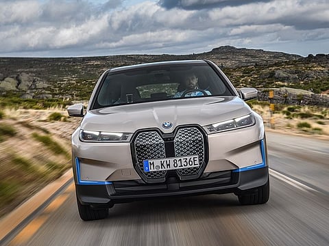 The kidney grilles on the BMW iX are far bigger than the kidneys on the automaker's petrol-burning models and are turned upright, with a glossy black lattice in place of the trademark vertical bars.