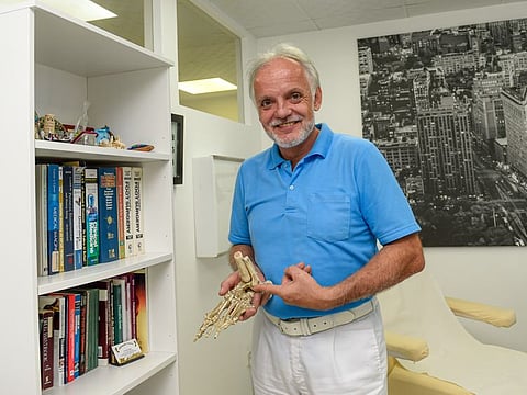 German expat and diabetic foot specialist Jorg Stobel, who has been working in Jumeirah for 25 years, at his poly clinic in the Sunset Mall.