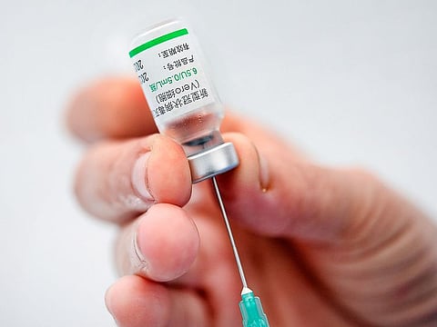 A healthcare worker prepares a dose of the Sinovac COVID-19 vaccine during a vaccination session for medical staff in Caracas, Venezuela.
