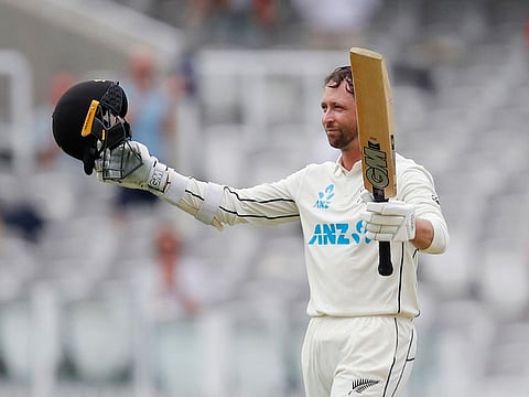 New Zealand's Devon Conway celebrates reaching his century.