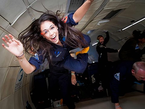 Researcher for the International Institute for Astronautical Sciences (IIAS), Kellie Gerardi, experiances weightlessness on a Zero Gravity plane.