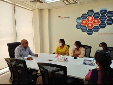 Dr Sanjay Paithankar interacts with a group of stranded nurses from Kerala in the UAE.