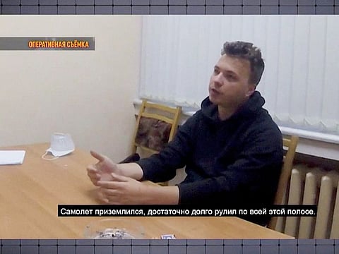 Belarusian dissident journalist Roman Protasevich speaks during questioning in an unknown location, in this still image taken from undated video footage.