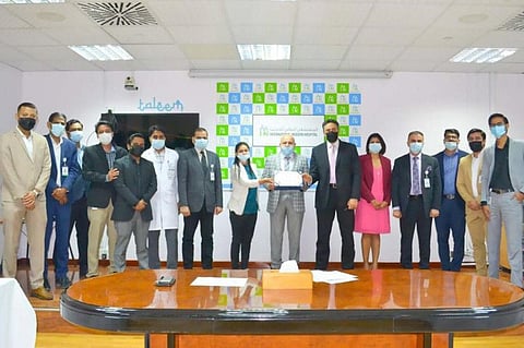 The team from International Modern Hospital in Dubai after receiving the award for distinguished service.