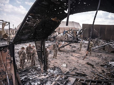 US military personnel survey damage at Al Asad Air Base in Anbar, Iraq, on January 13, 2020, after it was struck by Iranian missiles. Iran-backed militia groups in Iraq used armed drones to attack the base again on May 8, 2021.