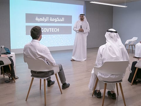 Mohammad Al Gergawi, Minister of Cabinet Affairs, speaking to participants in the presence of Ohood Al Roumi.