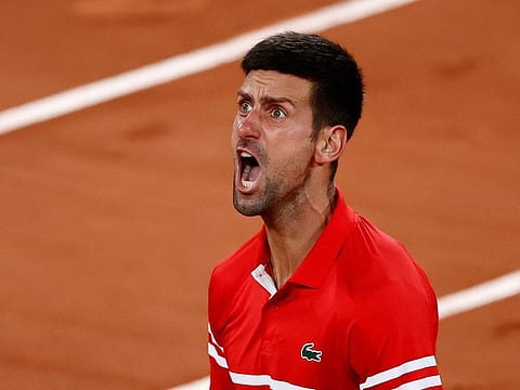 Novak Djokovic celebrates winning his quarter final match against Matteo Berrettini.