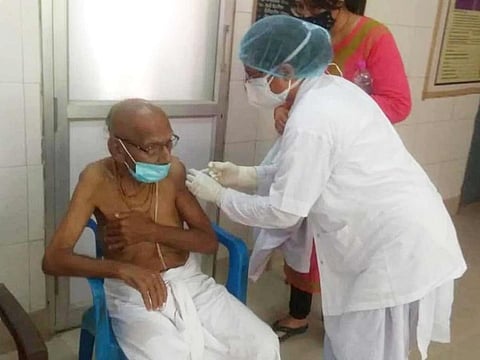 125-year-old Swami Shivanand is getting jab at a vaccine centre in Durga Kund, Varanasi.
