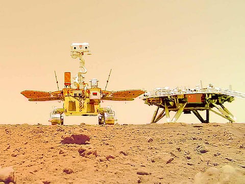 The Chinese Mars rover Zhurong is seen near its landing platform taken by a remote camera that was dropped into position by the rover.