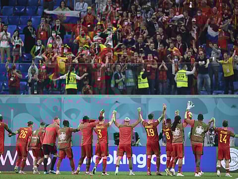 Belgium's players and their fans react after the Euro 2020 soccer championship group B match between Russia and Belgium at Gazprom arena stadium in St. Petersburg, Russia.