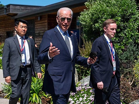 President Joe Biden walks with national security advisor Jake Sullivan, right, as he arrives for the final session at the G-7 summit in Carbis Bay, England on Sunday, June 13, 2021.