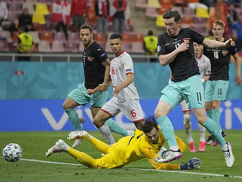 Austria's Michael Gregoritsch (right) scores his side's second goal during the Euro 2020 Group C match against North Macedonia at the National Arena stadium in Bucharest, Romania.