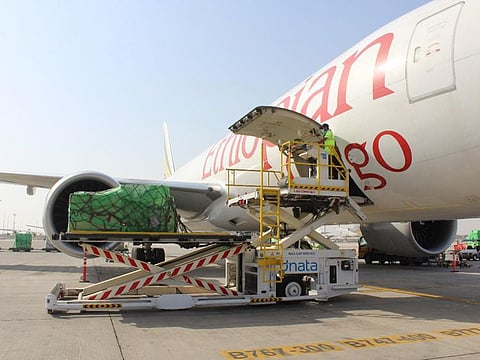 The Emirates cargo flight being loaded at Al Maktoum International Airport.