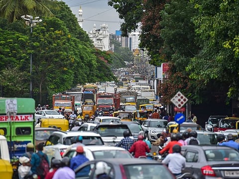 Vehicles stuck in a traffic jam at Townhall circle after authorities announced relaxation in COVID-19 lockdown, in Bengaluru on June 14.