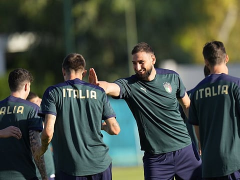 Italy goalkeeper Gianluigi Donnarumma jokes with teammates during a training session at Rome's Acqua Acetosa training center before the Euro 2020 championship Group A match against Switzerland.