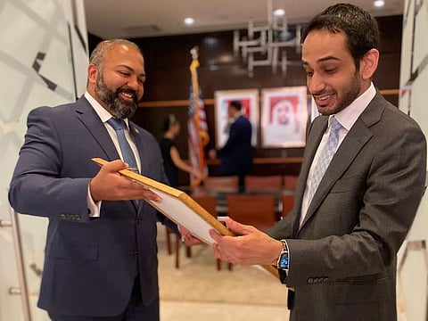 Abdalla Shaheen (right), Consul General of the UAE in New York, being presented with a copy of the Legislative Resolution by Senator Kevin Thomas, declaring December 2, 2021, as Emirati Day in New York state.