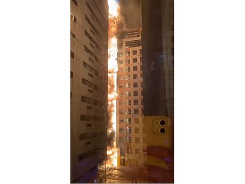 Fire burns at a building in Abu Dhabi.