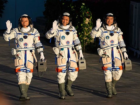 File picture: Chinese astronauts, from left, Tang Hongbo, Nie Haisheng, and Liu Boming wave as they prepare to board for liftoff at the Jiuquan Satellite Launch Centre in Jiuquan in northwestern China, Thursday, June 17, 2021.