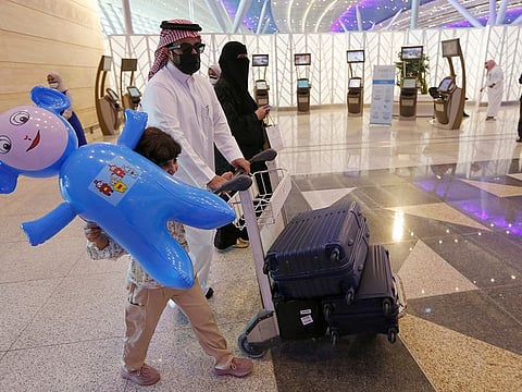 Saudi passengers prepare to check-in for flights at the King Abdulaziz International Airport in Jeddah, Saudi Arabia.
