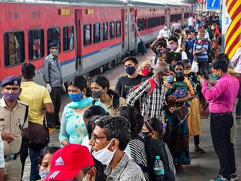 Passengers arriving from Gujarat, wait in a queue for Rapid Antigen COVID-19 test, at Dadar Station in Mumbai, on une 17, 2021.